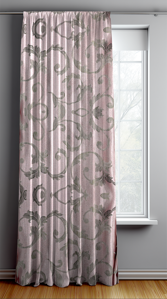 Decorative curtain with floral pattern in a room with a window.