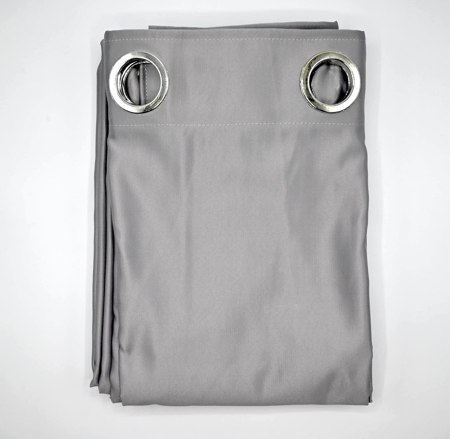Folded Cool Grey curtain with silver grommets on a plain white background