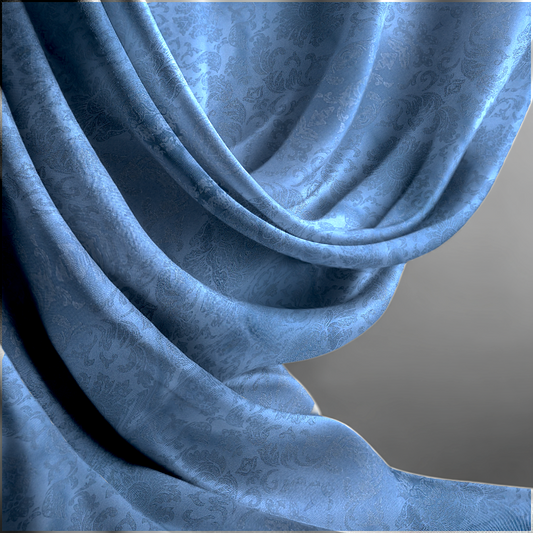 Close-up of blue textured fabric with a pattern on a gray background