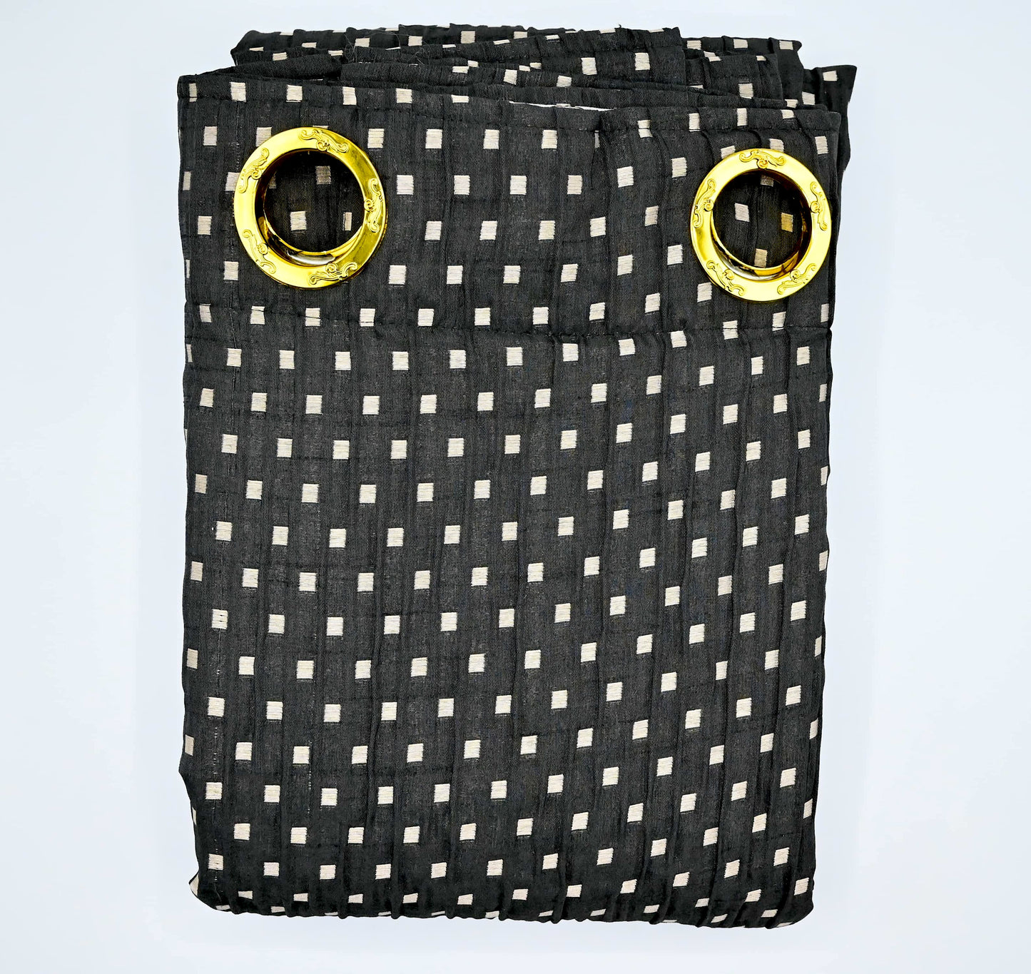 Black and white checkered curtain with gold eyelets on a light blue background