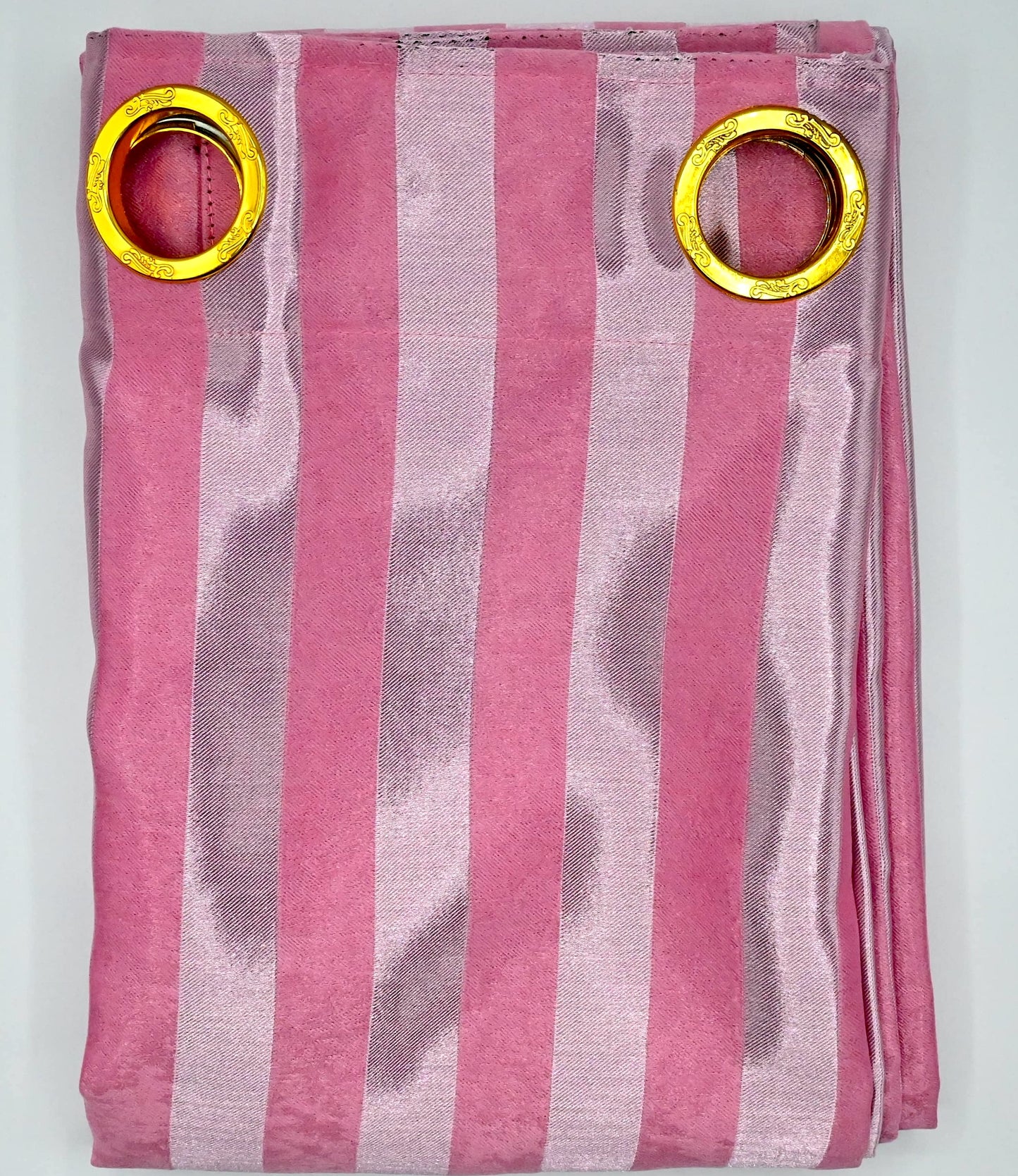Pink and gray striped curtain with gold rings on a white background