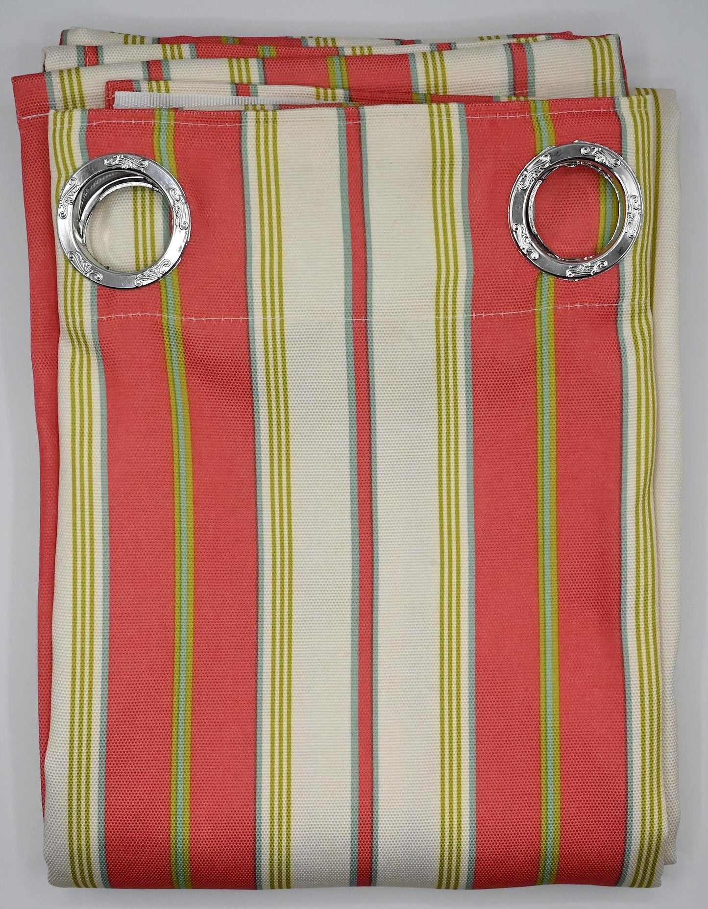 Striped curtain panel with silver rings on a gray background