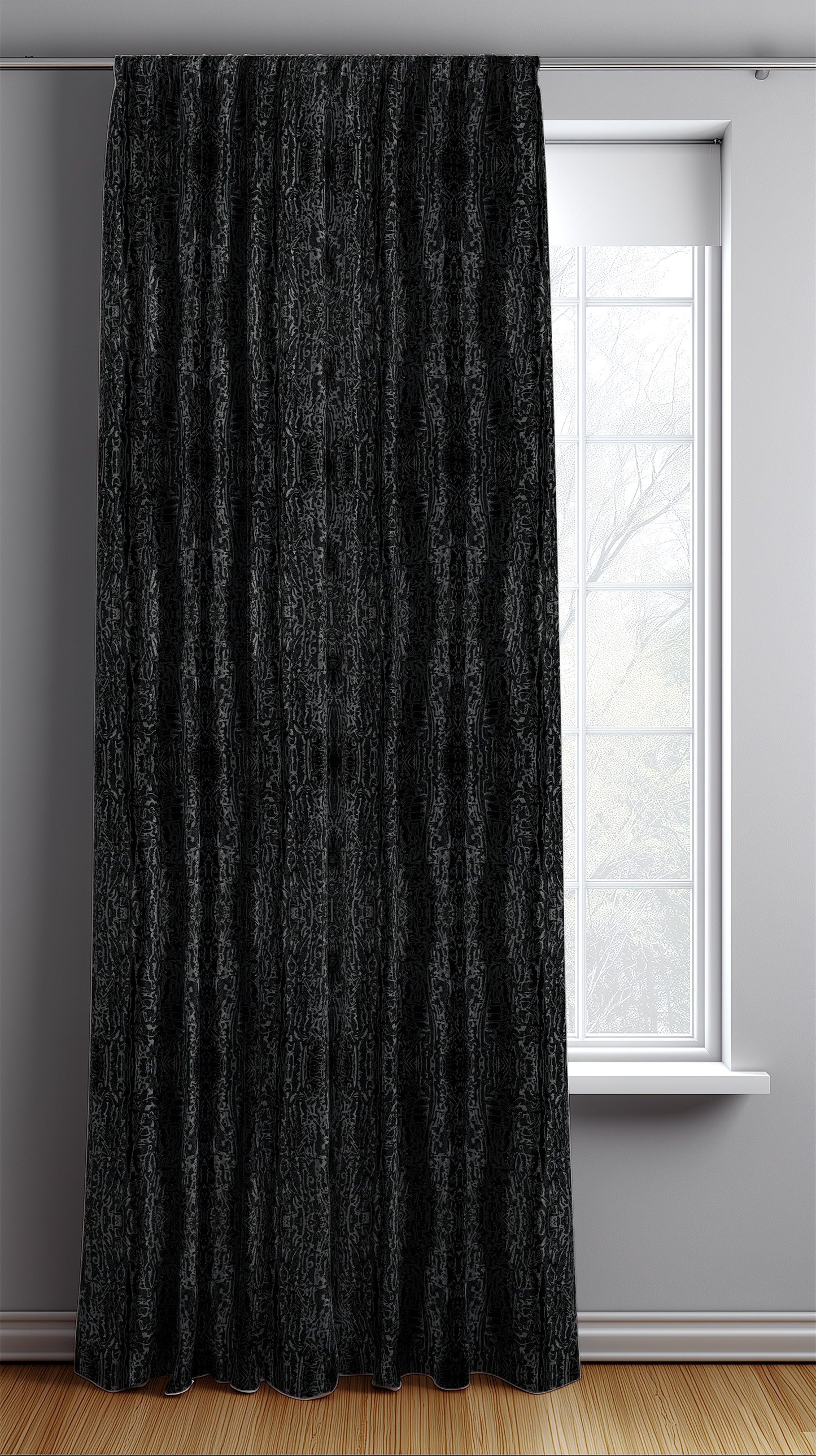 Black textured curtain in front of a window with a light gray wall.