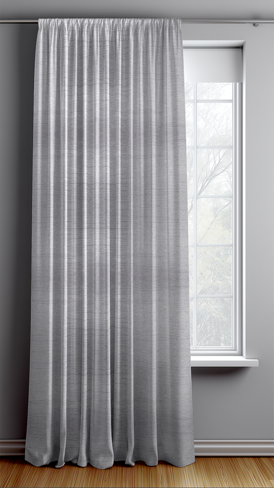 Gray curtain hanging in front of a window with a light gray wall background