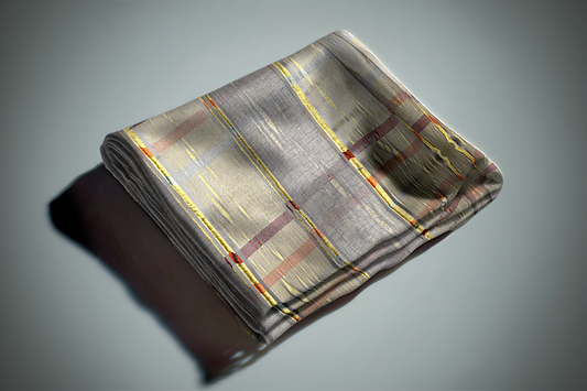 Gray geometric curtain fabric with gold and rust colored linear pattern and modern woven design folded on surface