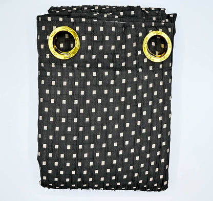 Black and white checkered curtain with gold eyelets on a light blue background