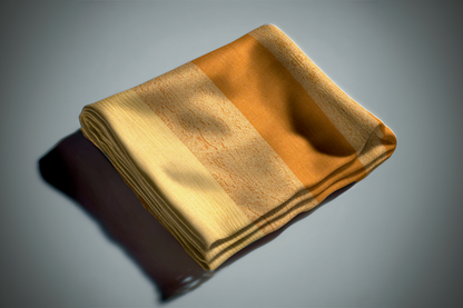 Golden yellow curtain fabric with metallic sheen and textured weave folded on white surface