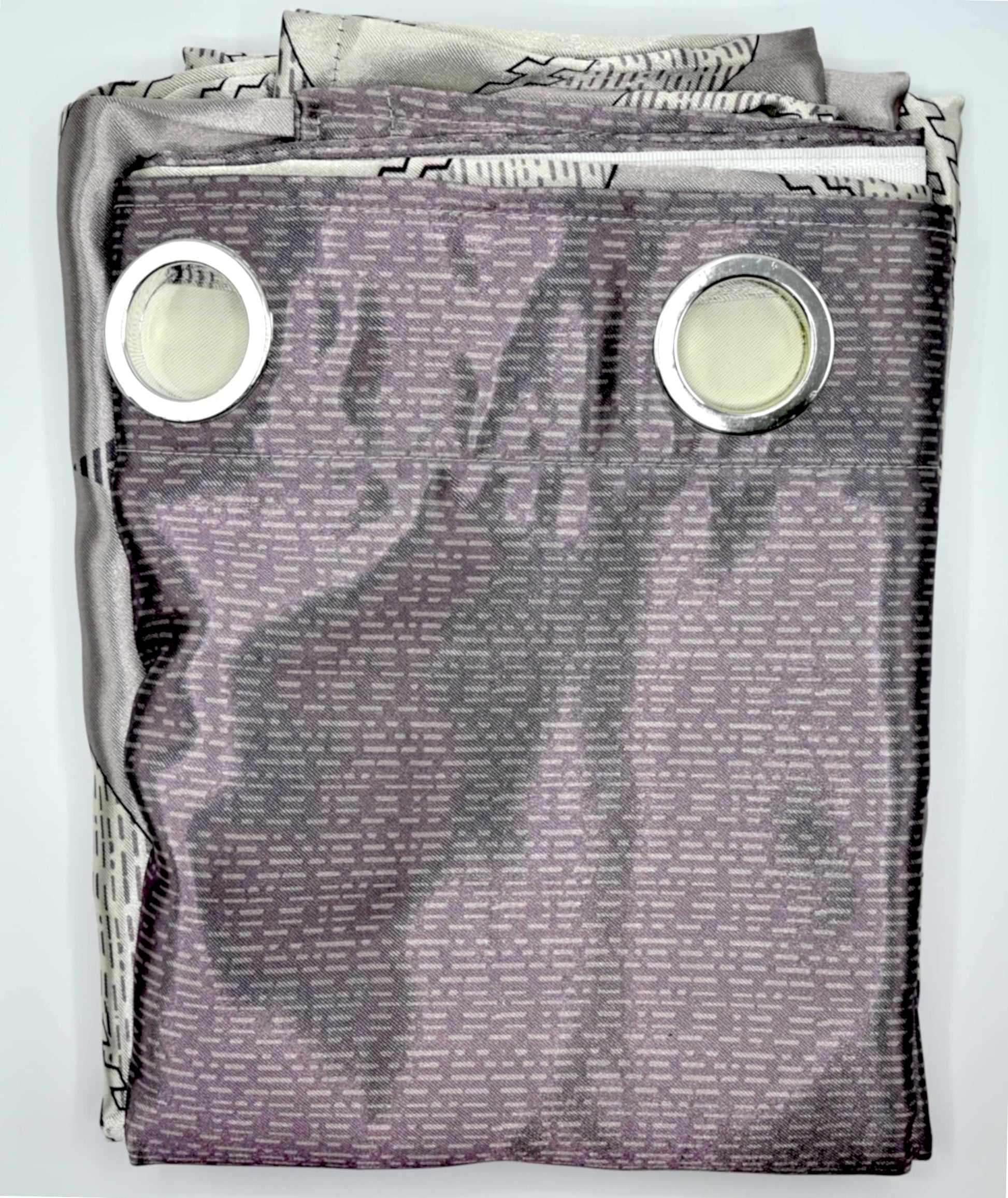 Folded fabric with grommets on a light gray background